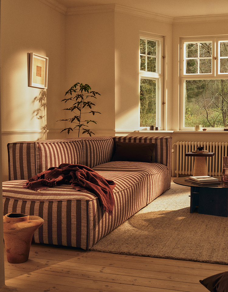 A modular sofa arranged in a compact living room