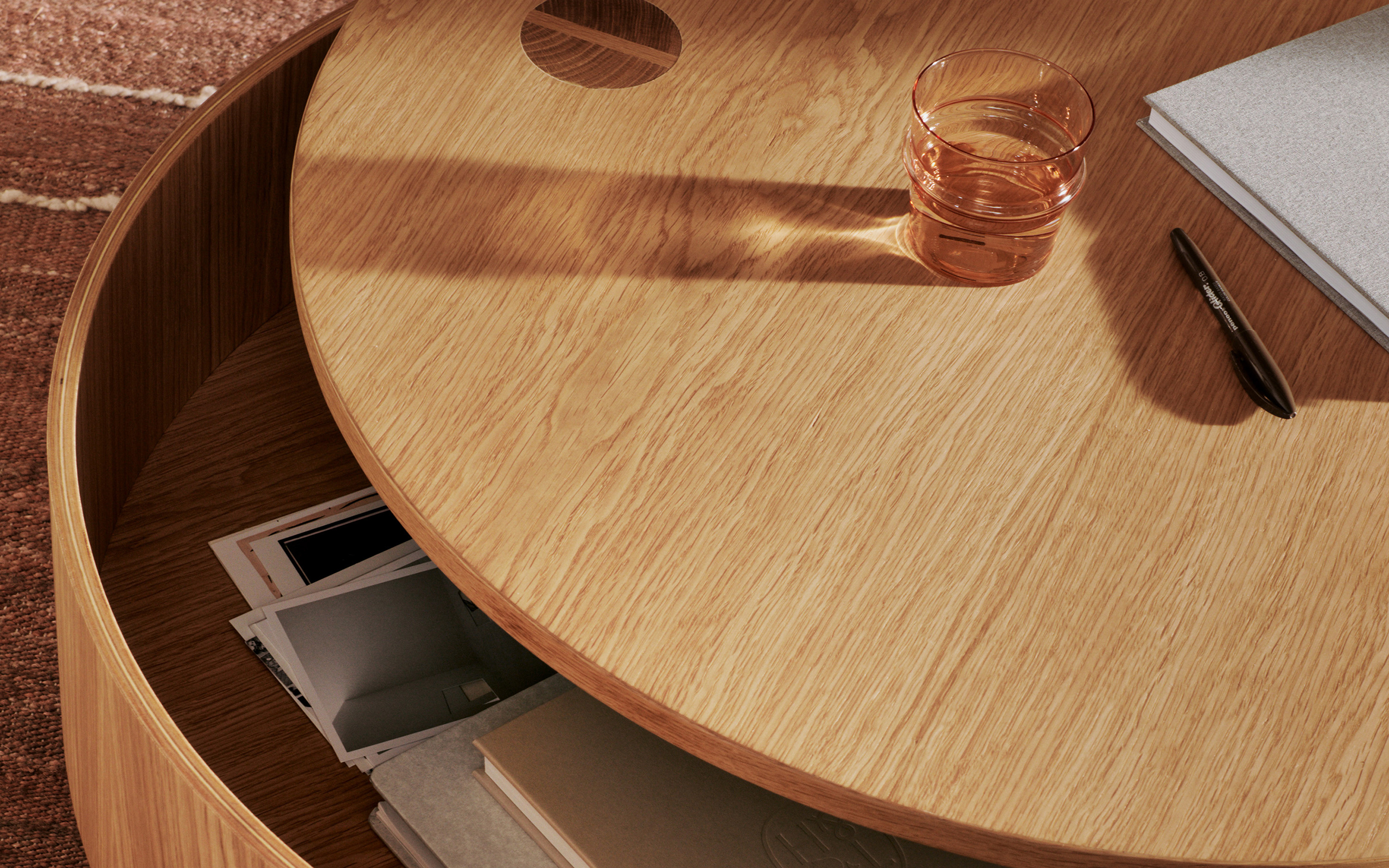 A storage ottoman doubling as a coffee table in a small living room