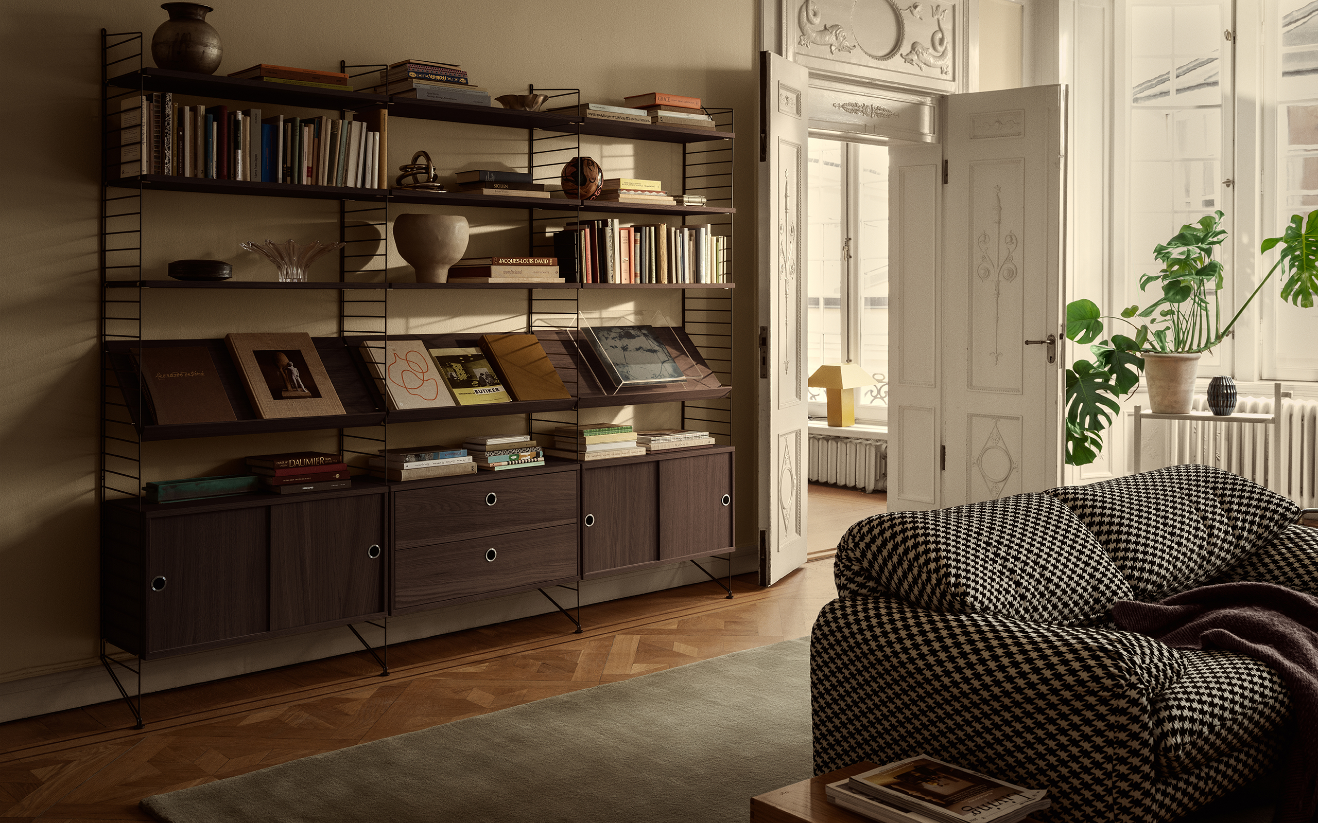 Tall narrow shelving making use of vertical wall space